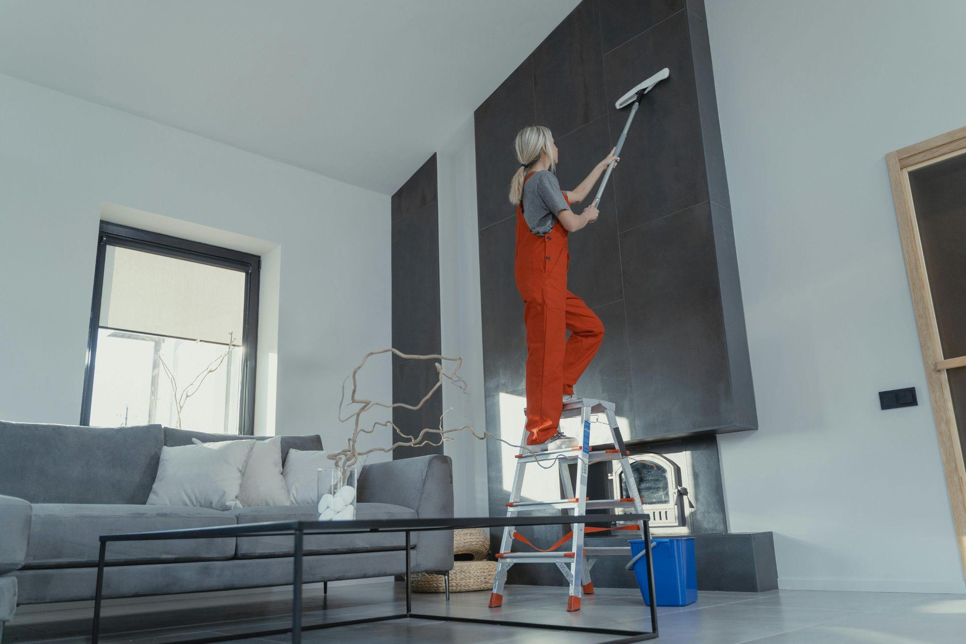 Woman cleaning the interior of a home