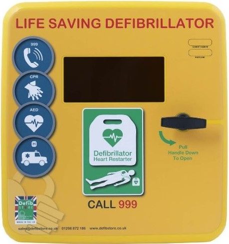 A yellow life saving defibrillator with a call 999 button.