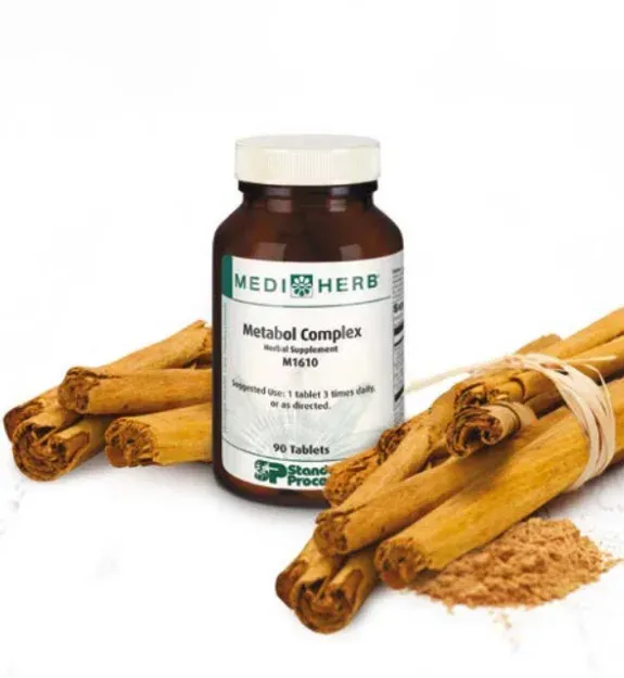 Bottle of MediHerb Metabol Complex tablets with cinnamon sticks and powder.