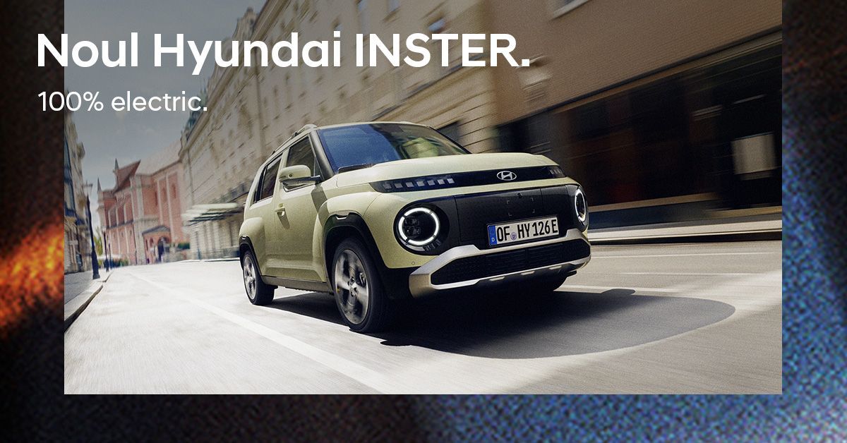A white car is parked in a tunnel. Inster