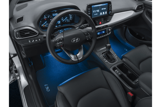 The interior of a hyundai i30 with blue lights on the floor.
