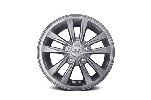 A close up of a hyundai wheel on a white background.