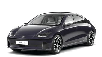 A green car with a black roof is on a white background.