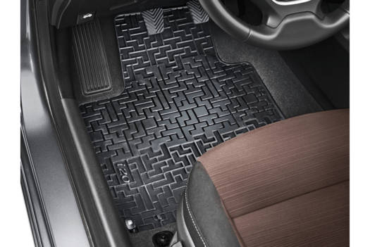 A close up of a car floor mat in a car.