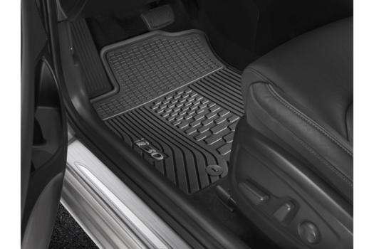 A black car with a rubber mat on the floor