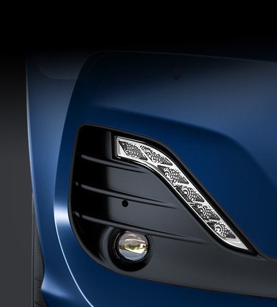 A close up of the front of a blue car i30