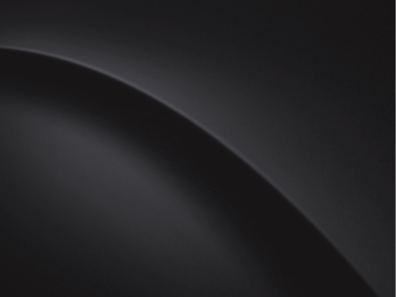 A black background with a curve in the middle Staria