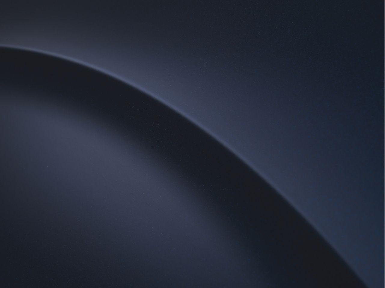 A dark blue background with a curve in the middle
