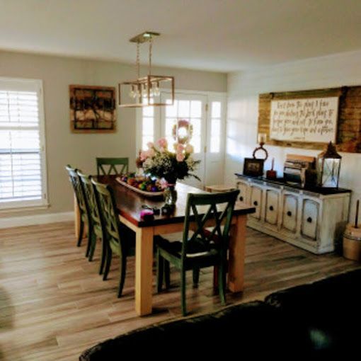 A living room with a dining table and chairs