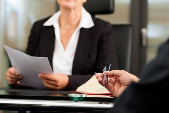 Bail Bondsmen — Lady Holding Papers in Salisbury, NC Bail Bondsmen — Lady Holding Papers in Salisbury, NC