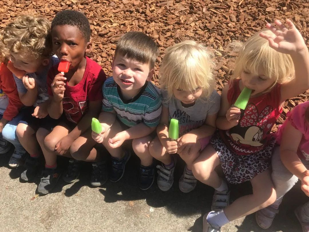 Students Eating a Popsicles — Sacramento, CA — Tot Town Child Development Center, Inc.