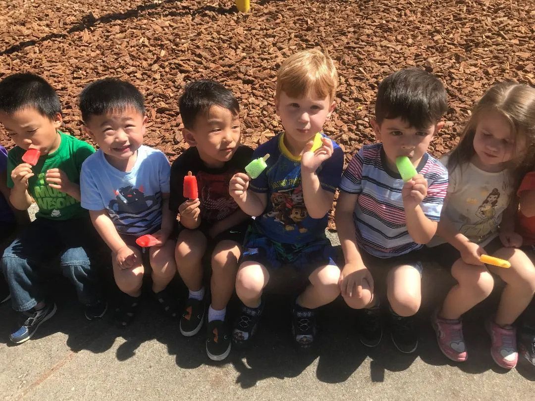 Children Eating a Popsicles — Sacramento, CA — Tot Town Child Development Center, Inc.