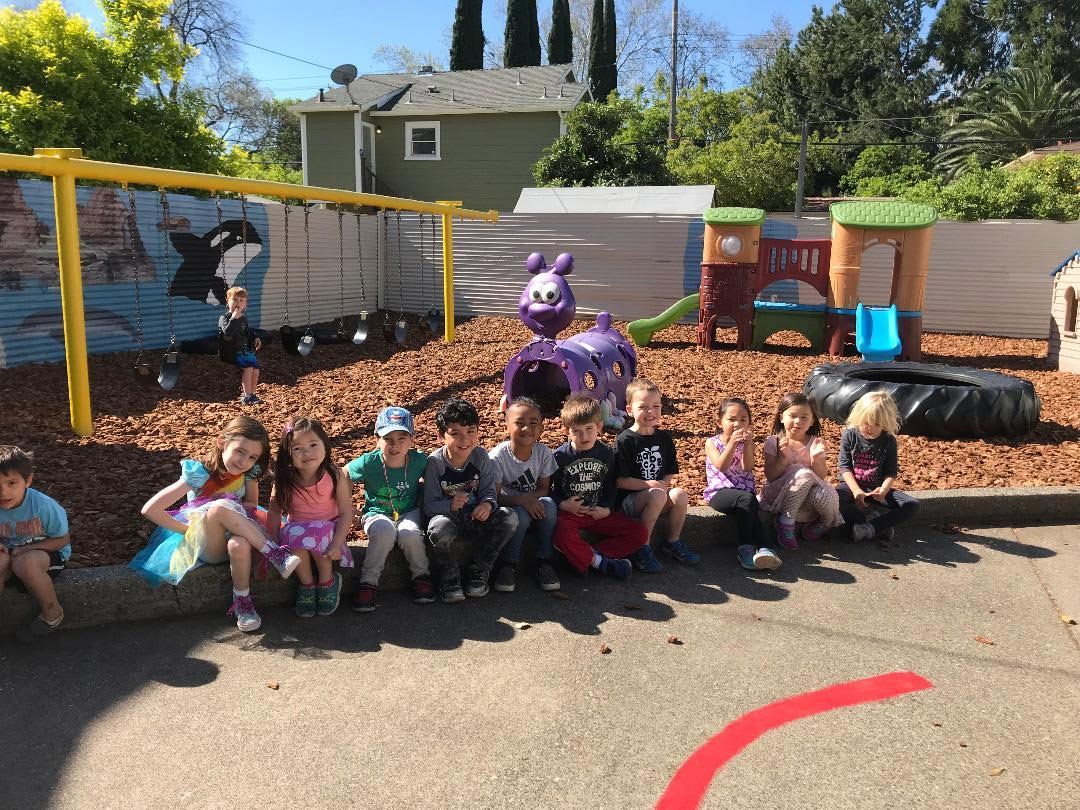 Children Sitting on Sidewalk — Sacramento, CA — Tot Town Child Development Center, Inc.