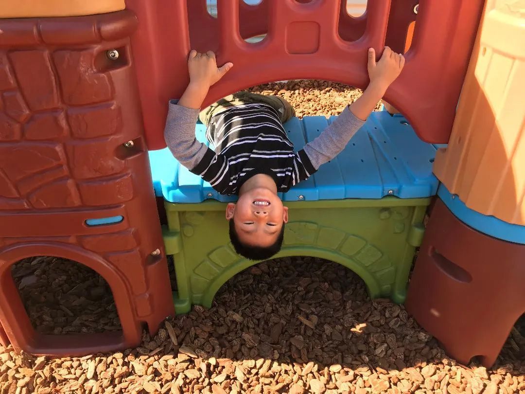 Boy Playing on Playground — Sacramento, CA — Tot Town Child Development Center, Inc.