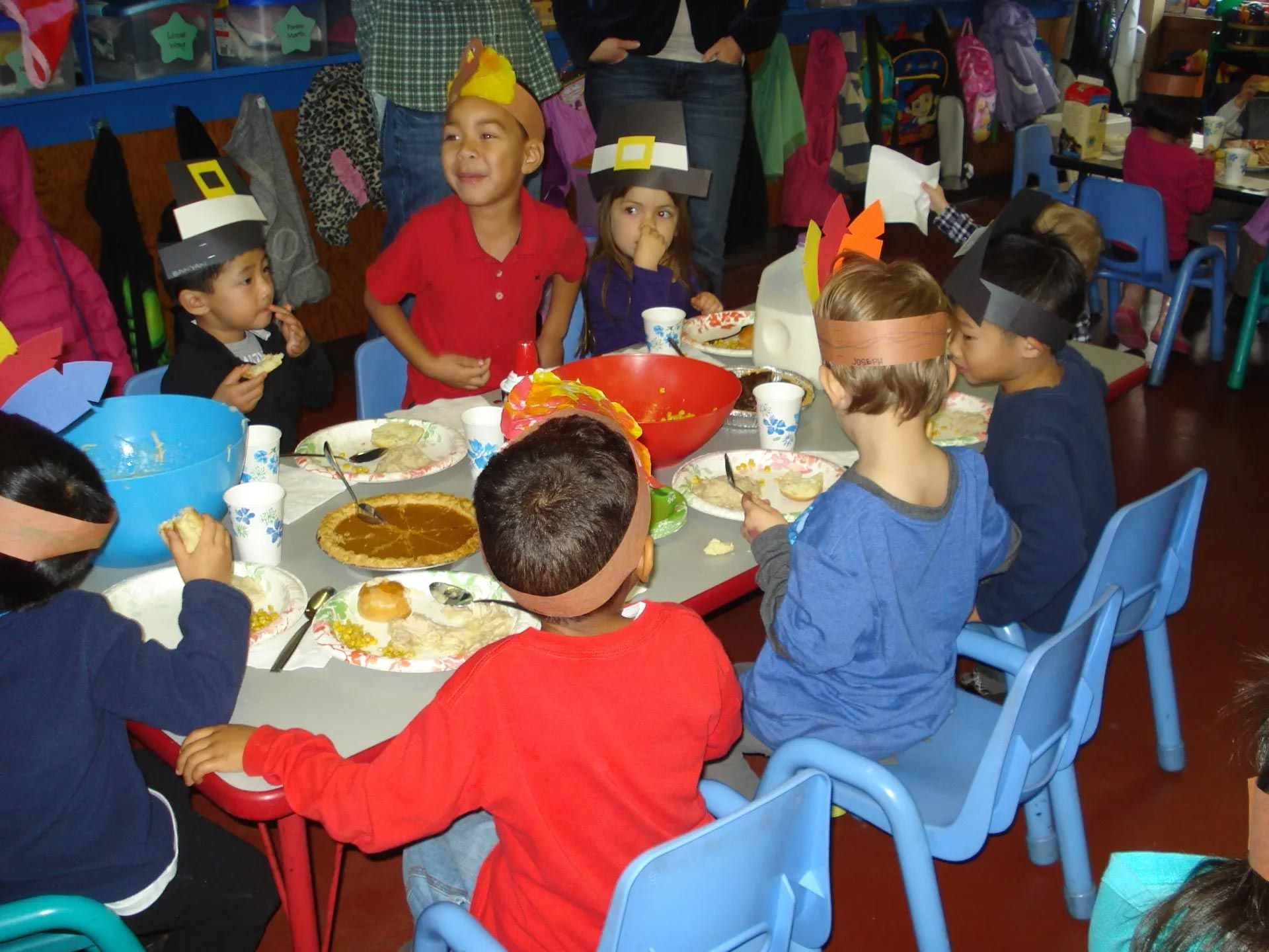 Children Eating Food on Table — Sacramento, CA — Tot Town Child Development Center, Inc.
