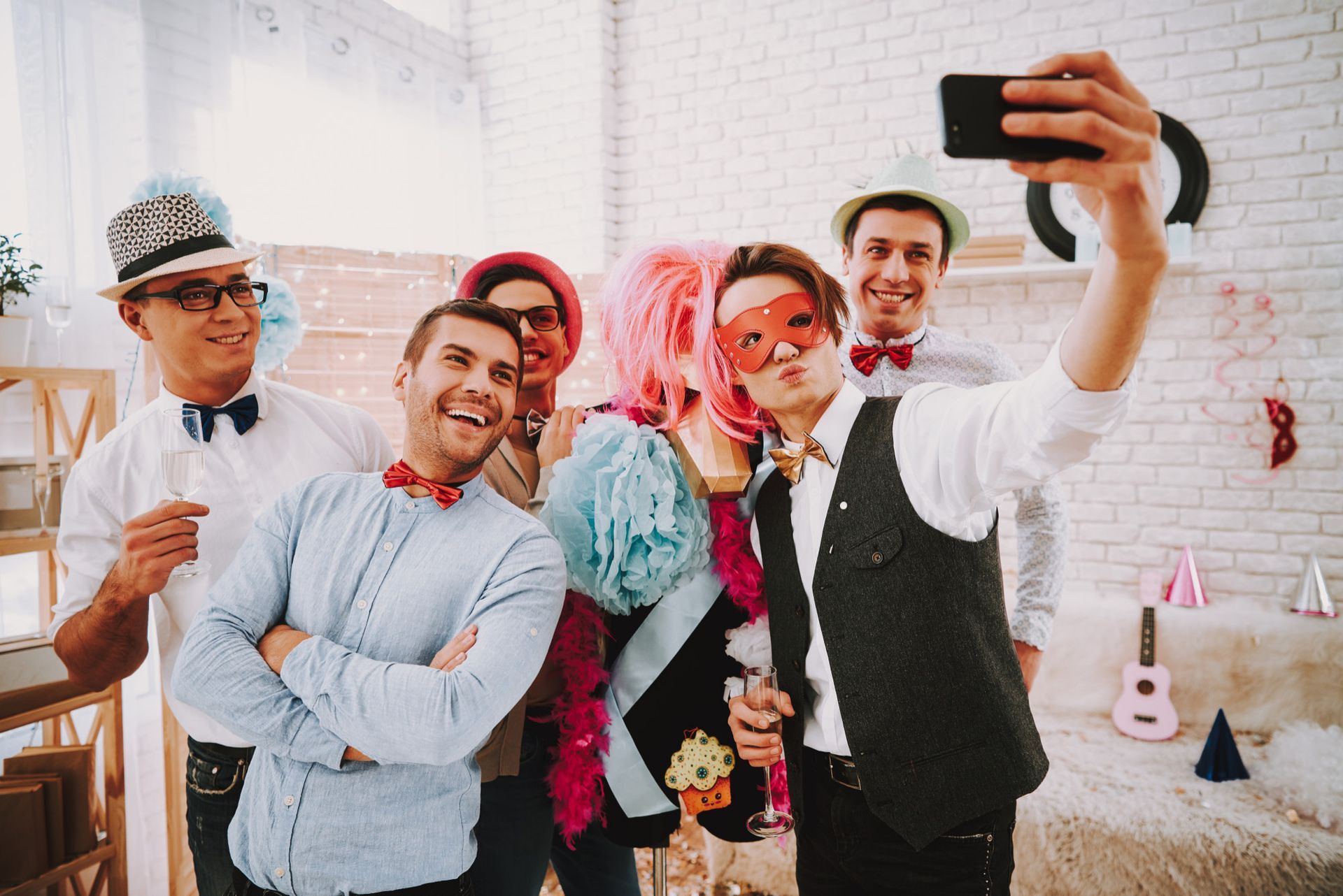 a group of people are taking a selfie together at a party .