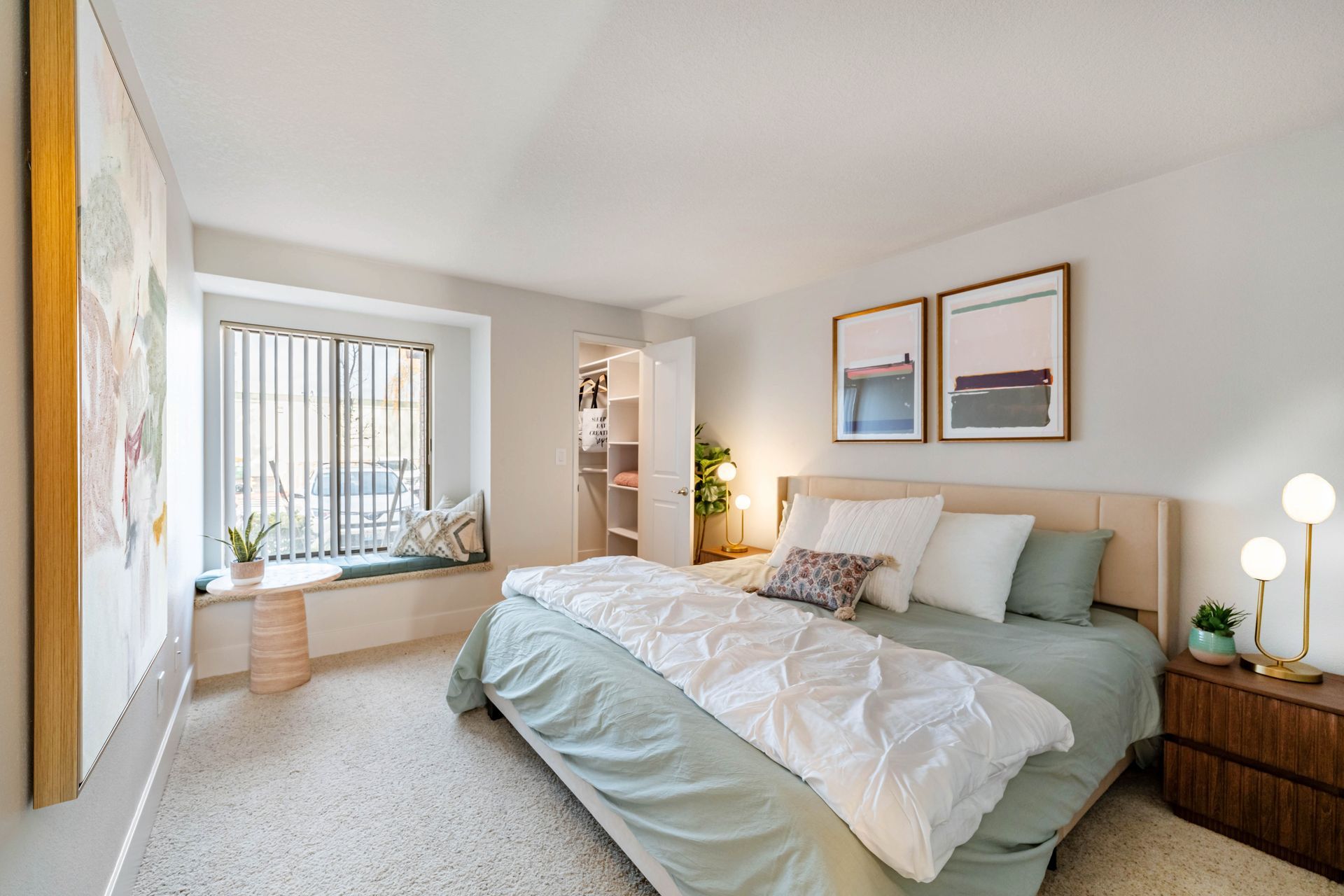 Person laughing, head tilted back, brown hair, wearing a green shirt, against a white background.