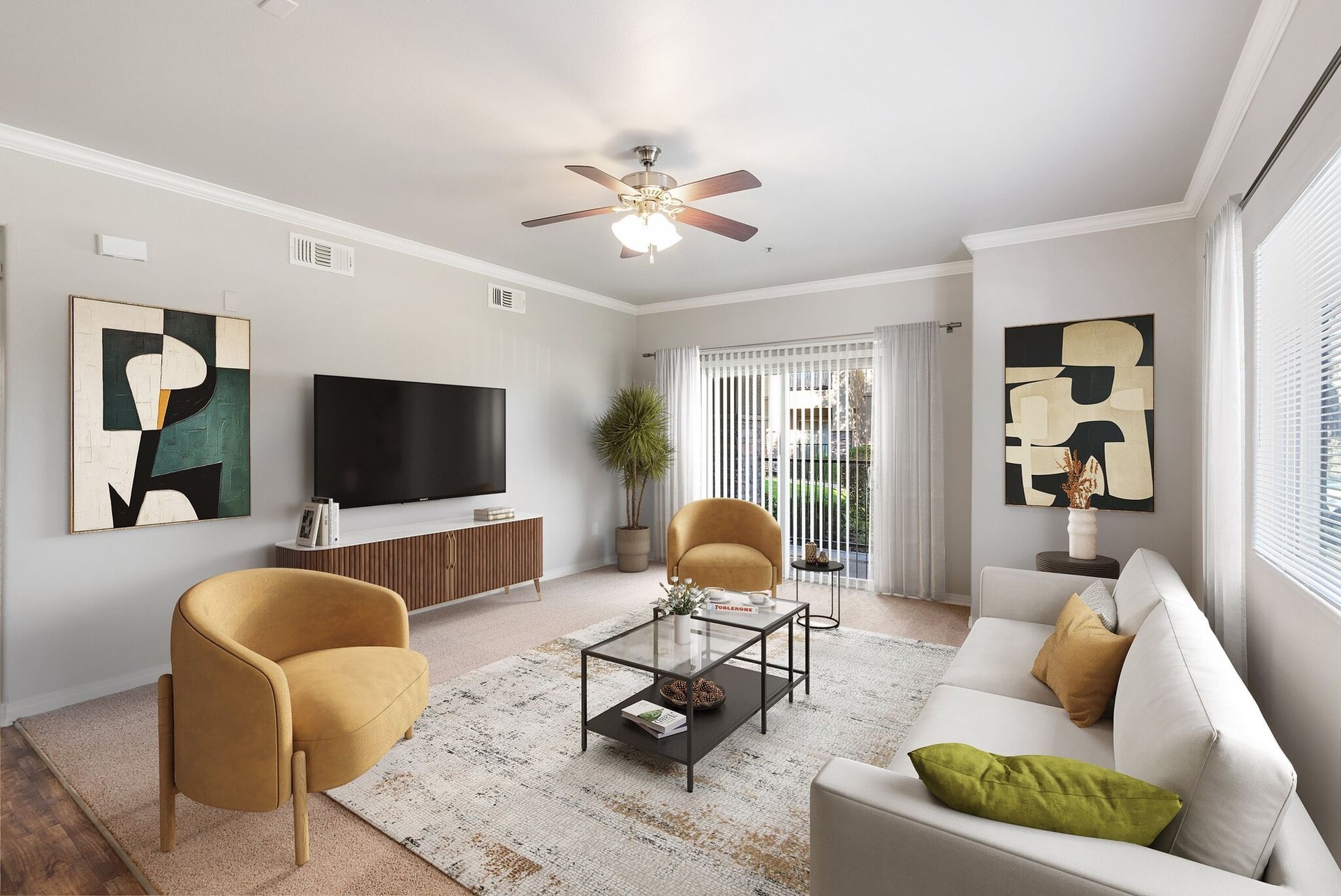 Living room with modern furniture, art, and a sliding door to the outside.