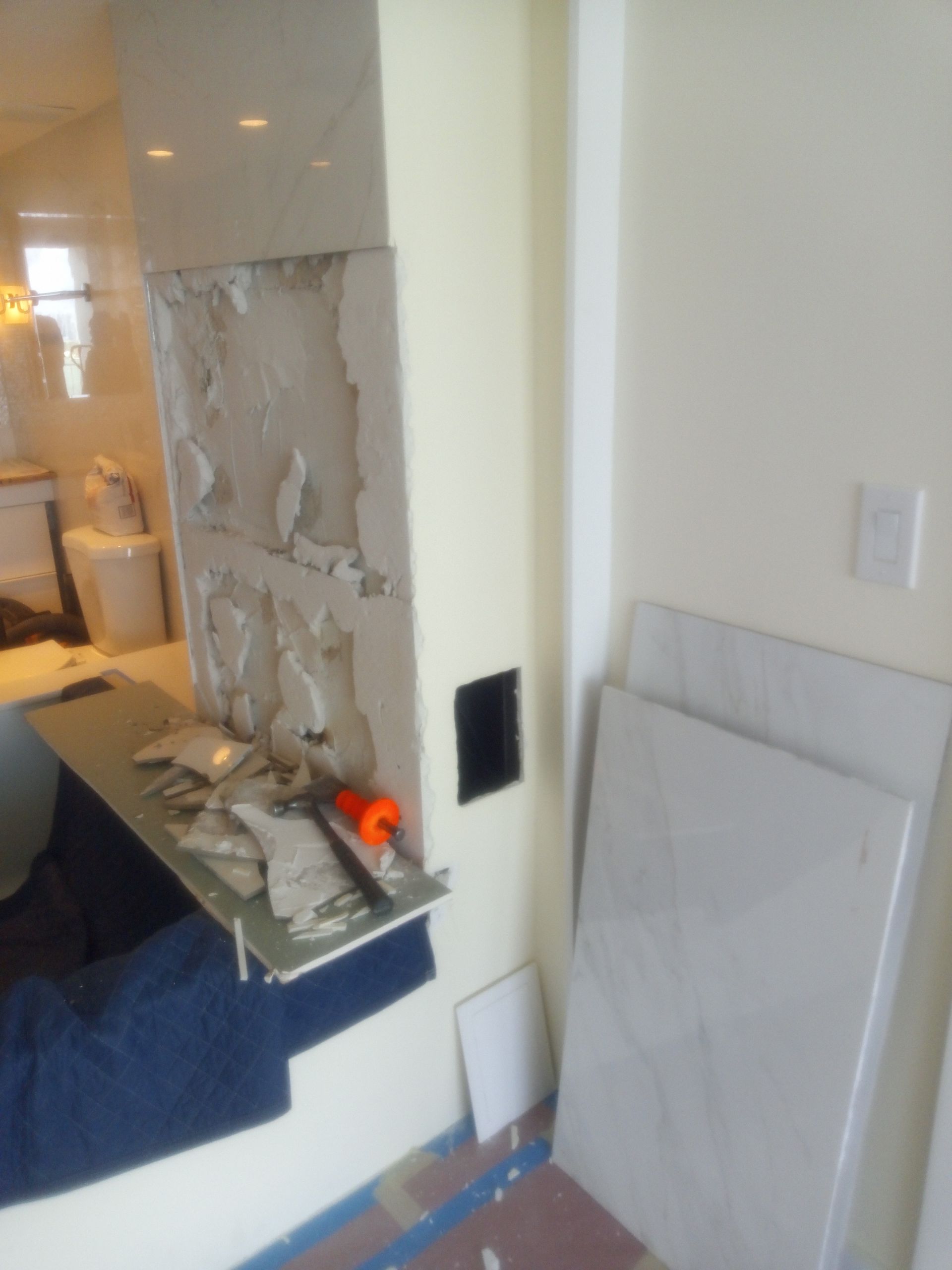 A bathroom being remodeled with a sink and a toilet
