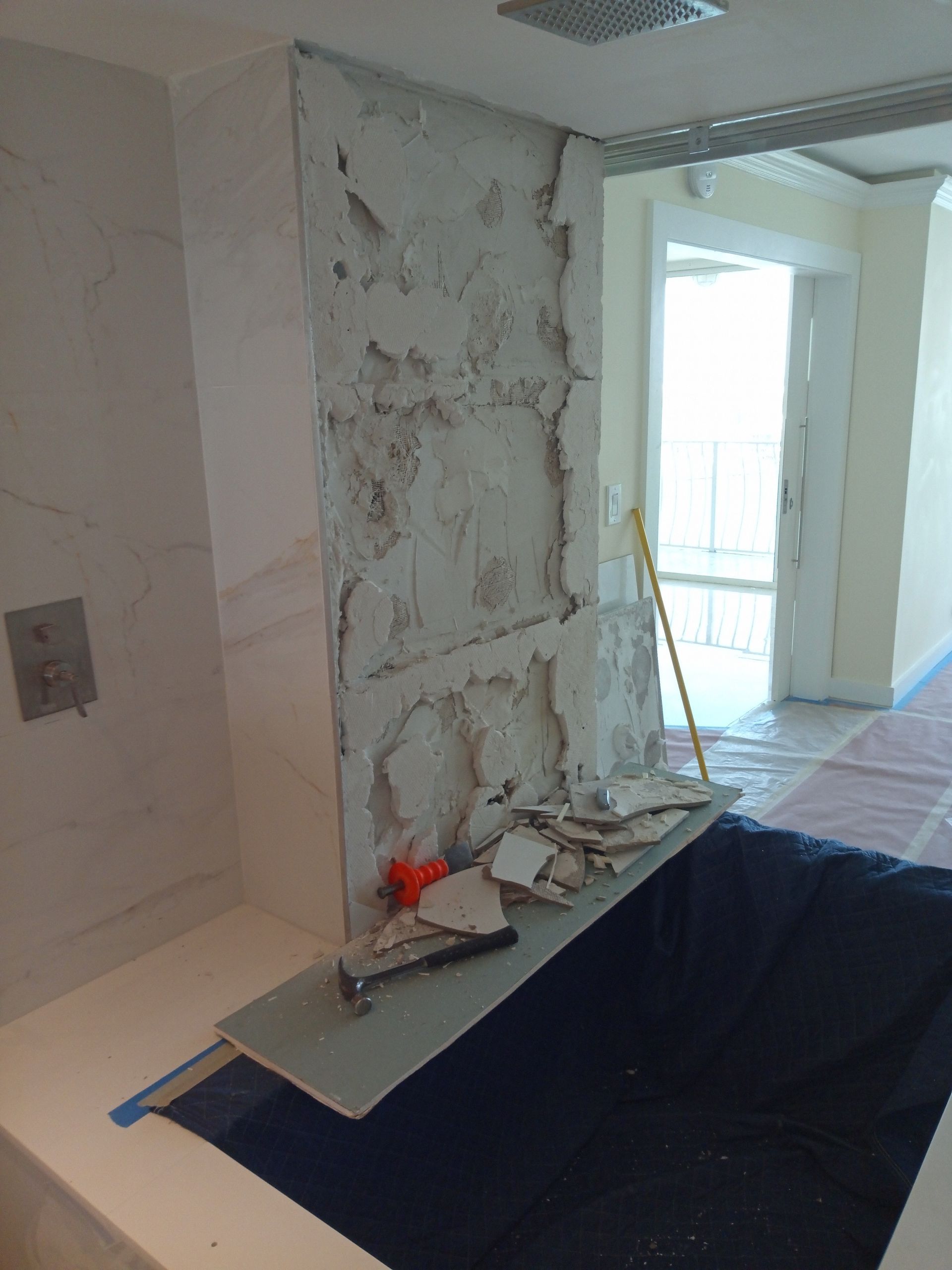 A bathtub is being remodeled in a bathroom.