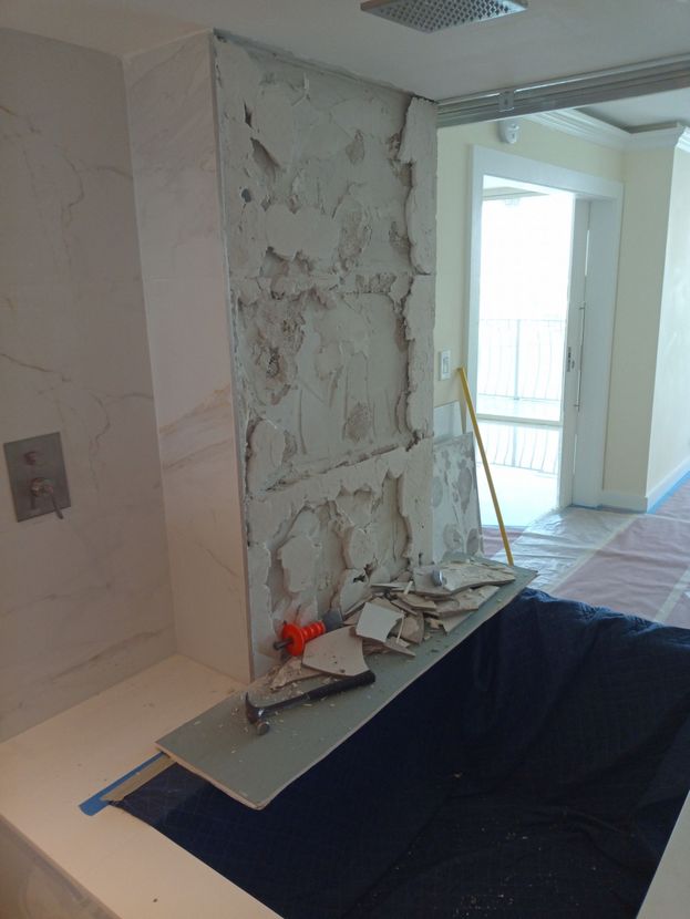 A bathtub is being remodeled in a bathroom.