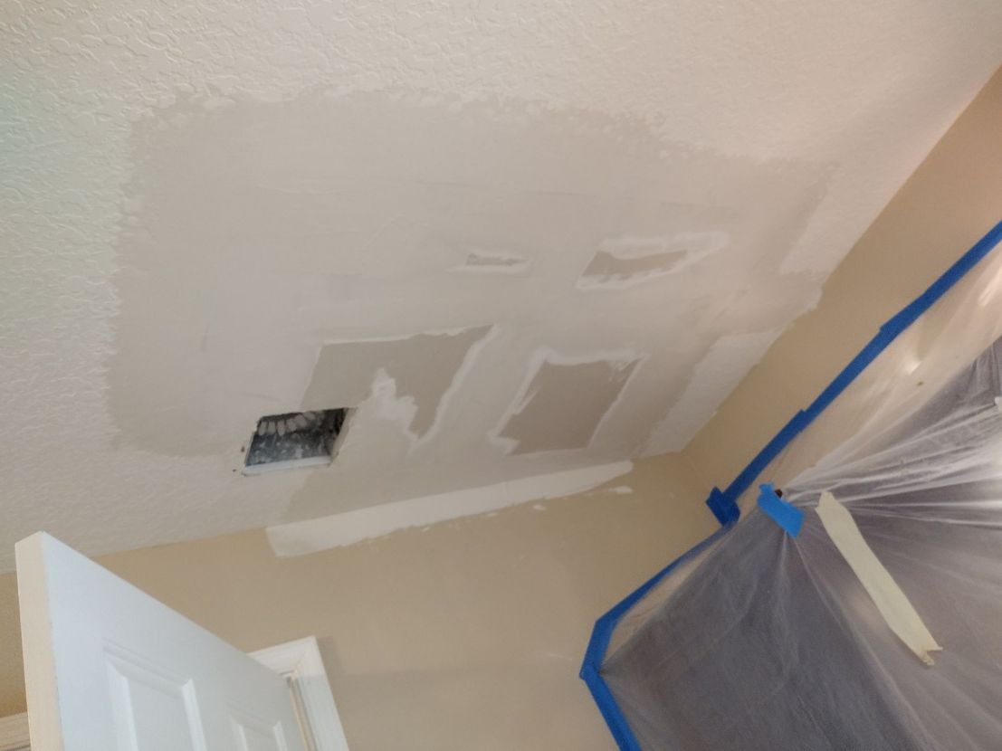 A room with a ceiling that has been painted white