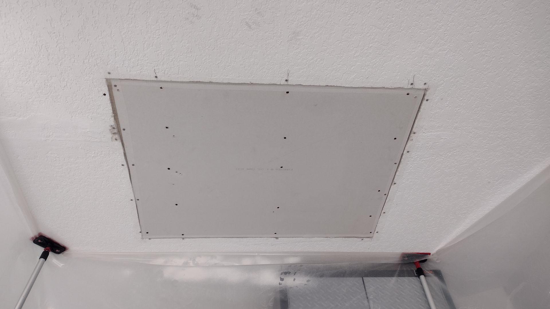 There is a hole in the ceiling that looks like a hole in the wall.