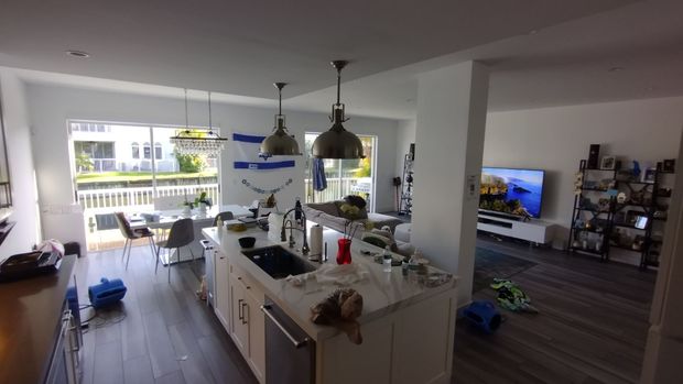 A kitchen with a large island in the middle of the room.