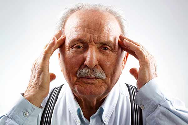 Old Man Holding His Head — Chattanooga, TN — Specialists In Pain Management
