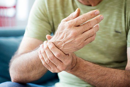 Old Man Holding Wrist — Chattanooga, TN — Specialists In Pain Management