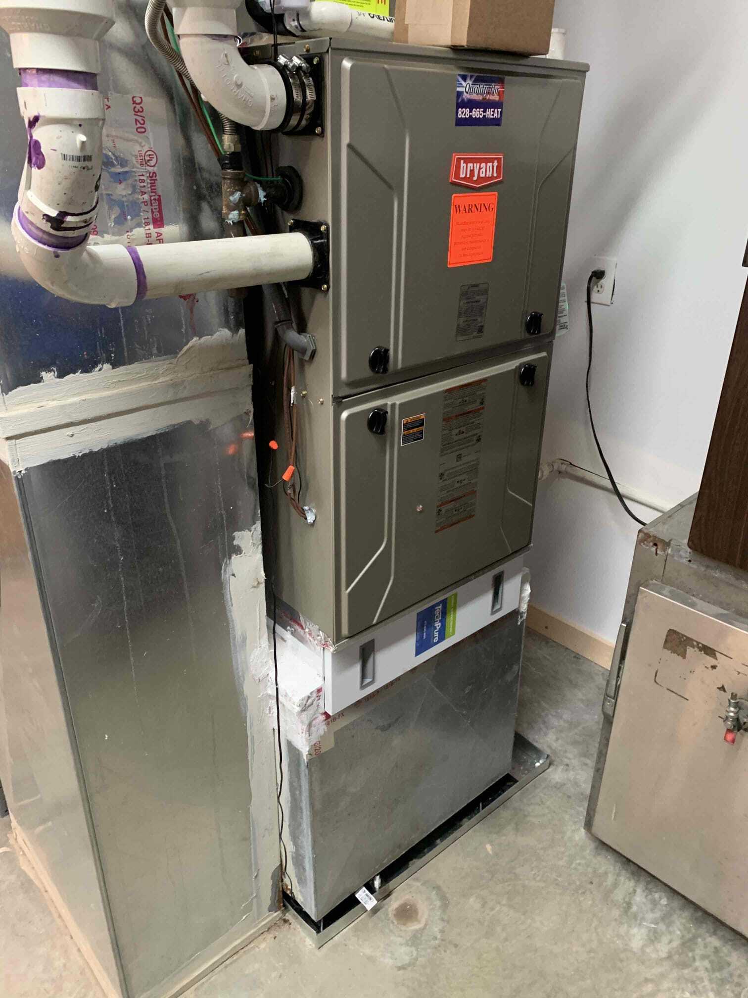 HVAC system with a warning sign — Asheville, NC — Quality Air