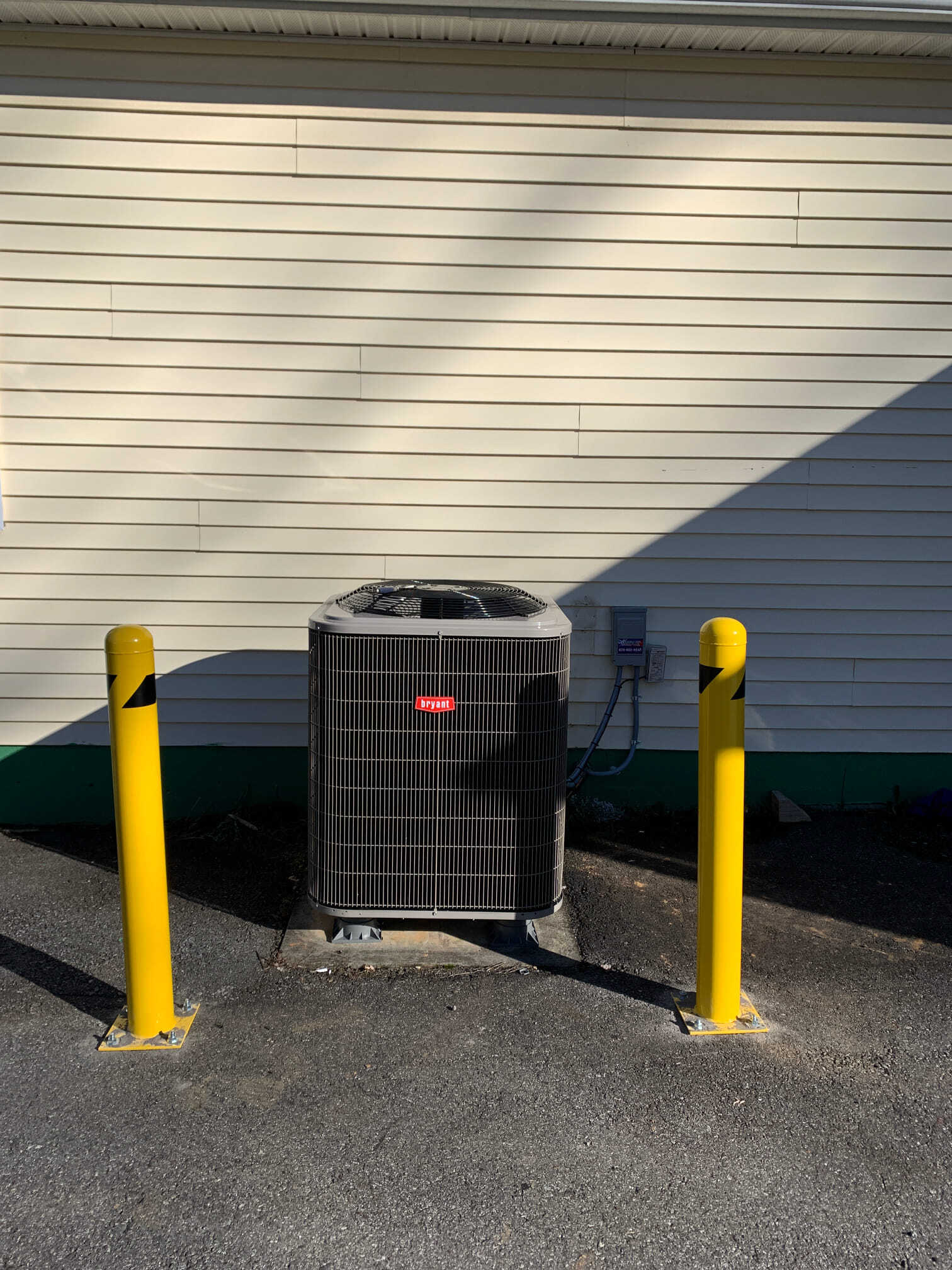 HVAC system behind two poles — Asheville, NC — Quality Air