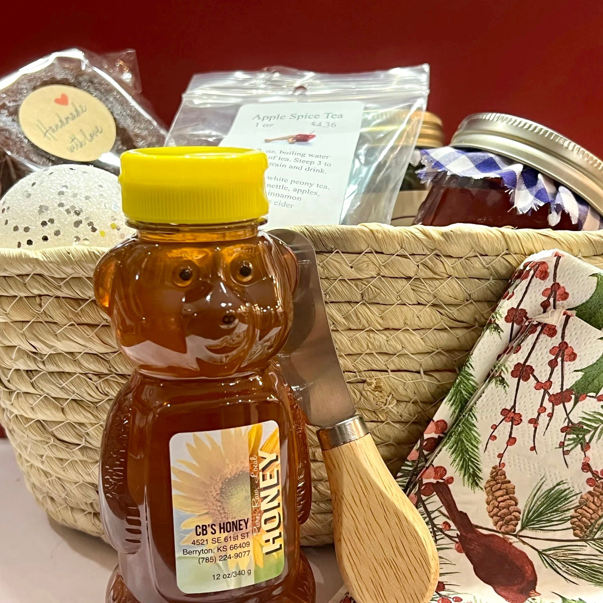 A bottle of honey in the shape of a teddy bear