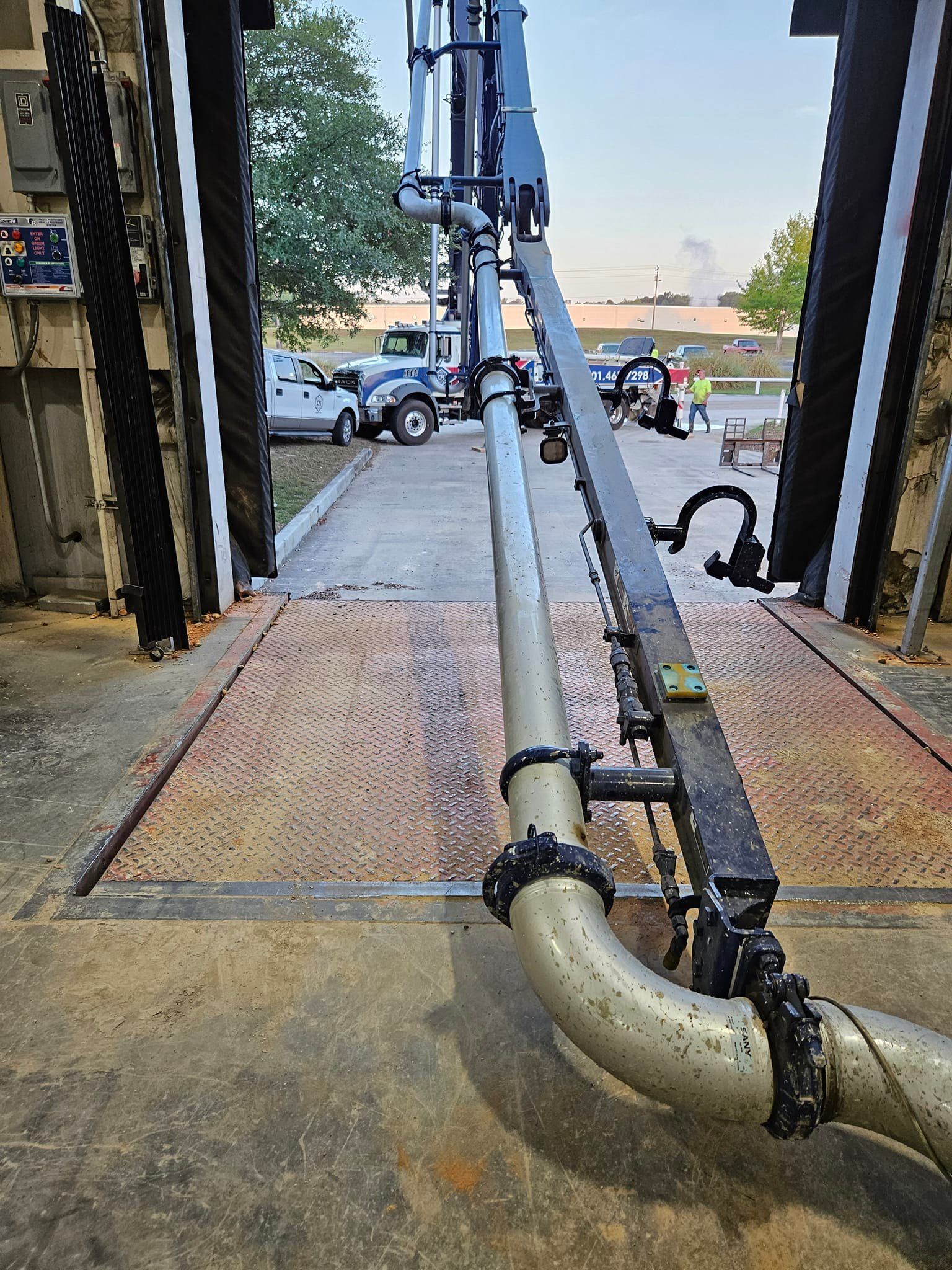 A close up of a pipe in a car wash.
