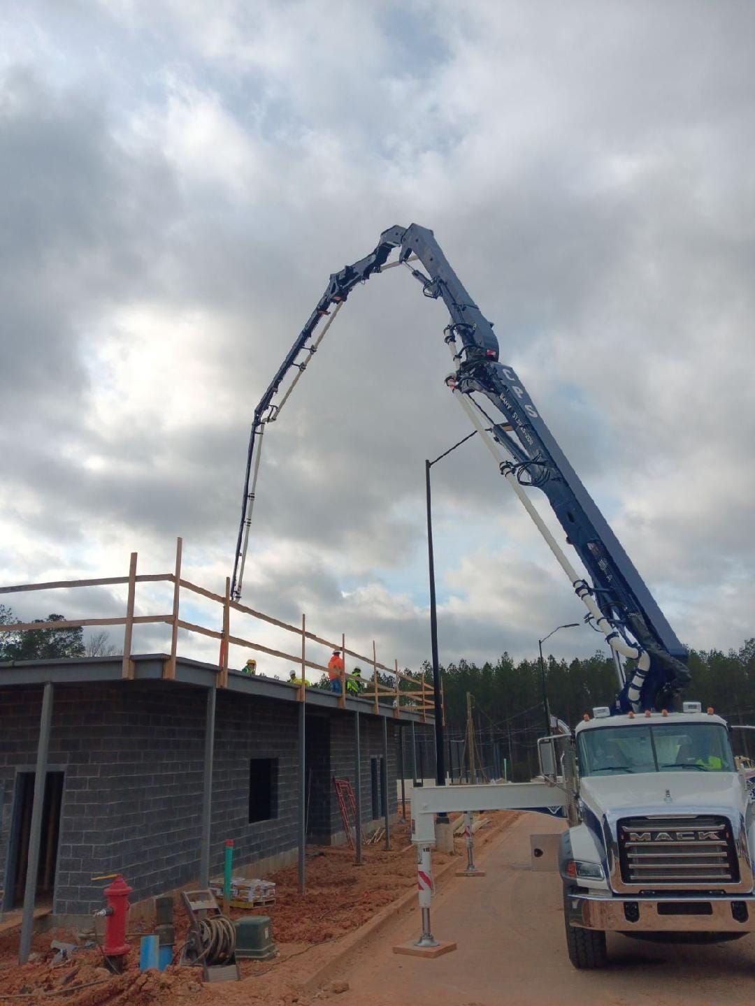 A mack truck with a crane attached to it