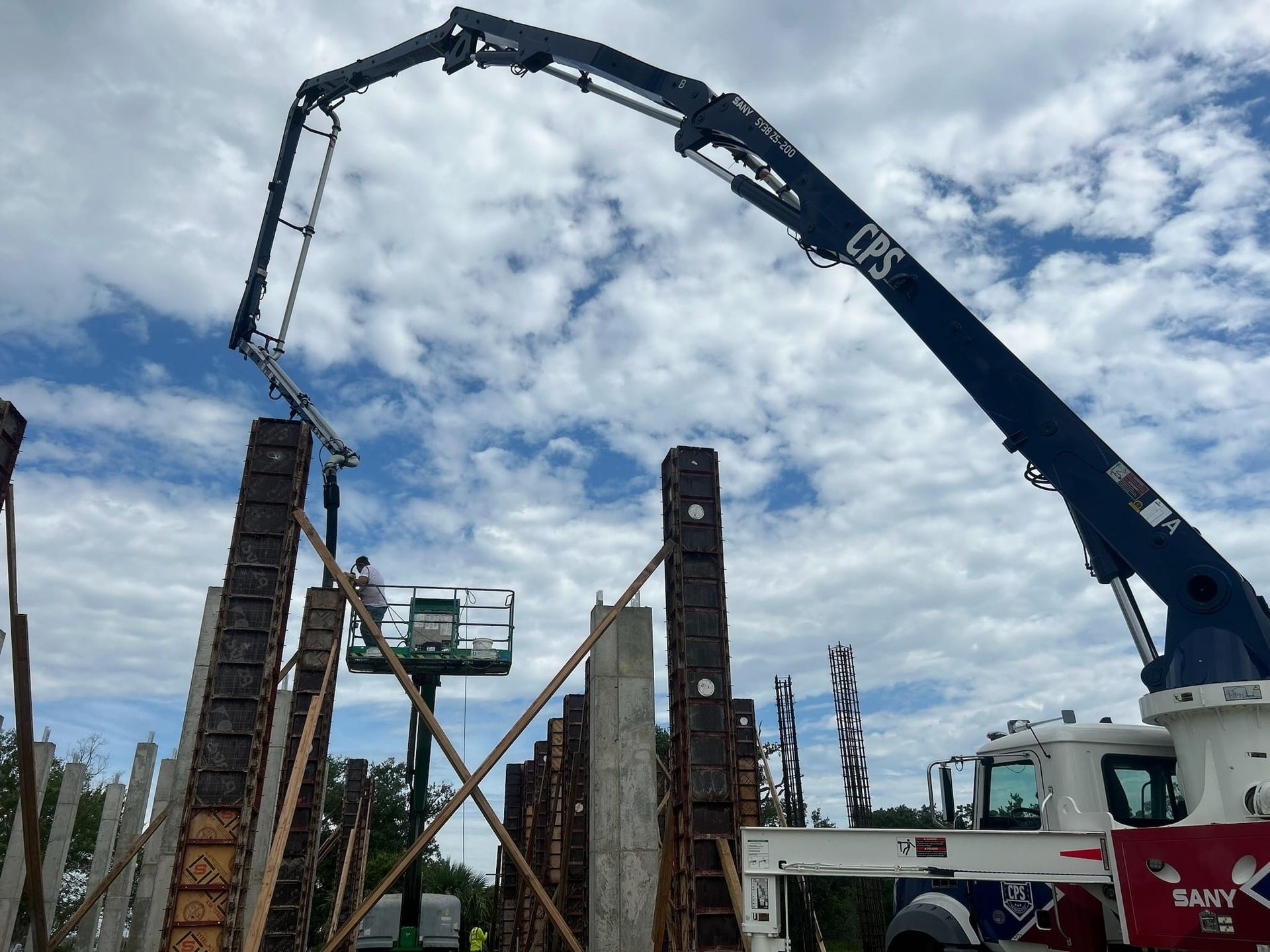 A concrete pump is being used on a construction site