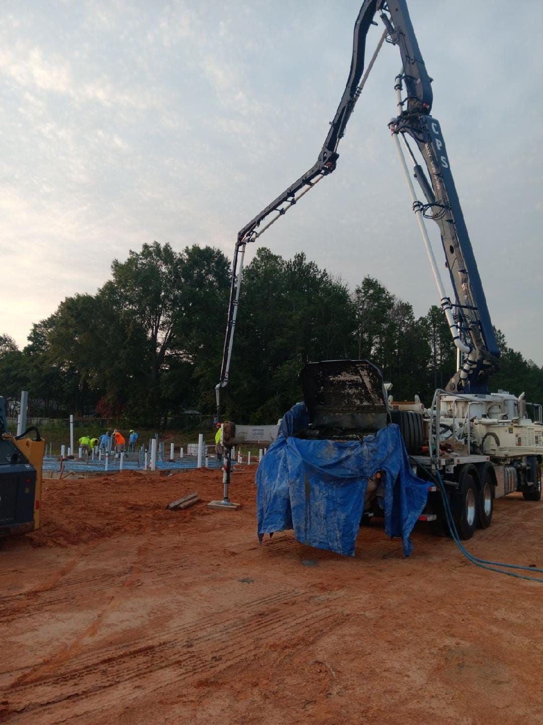 A concrete pump is being used on a construction site