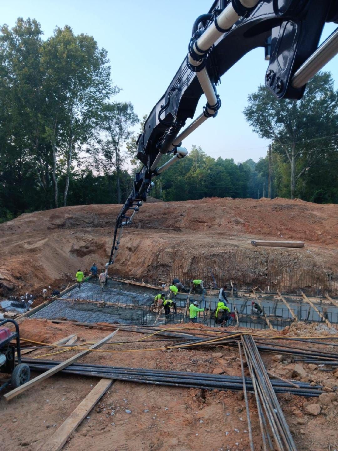 A group of construction workers are working on a construction site.