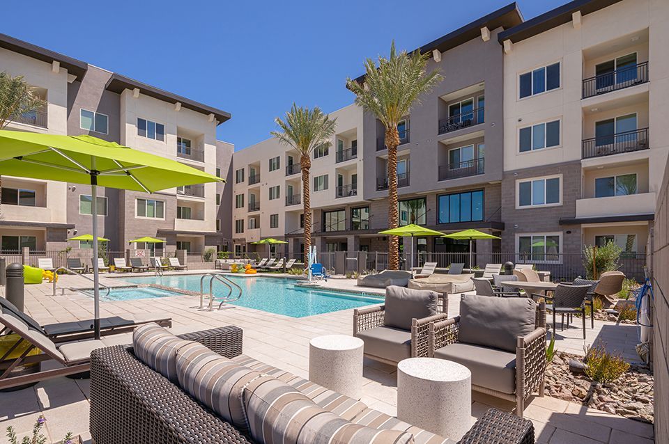 There is a large swimming pool in the middle of a building.