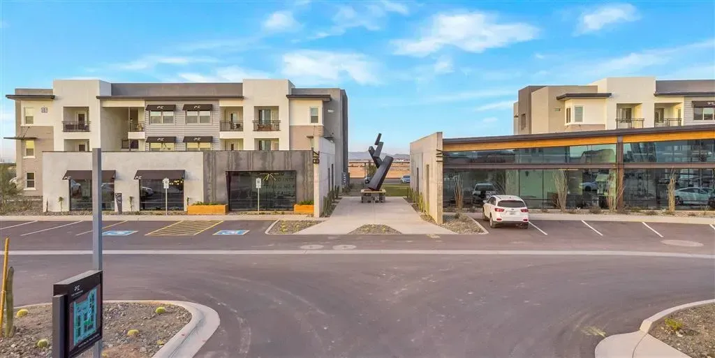 A blurry picture of a parking lot in front of a building.