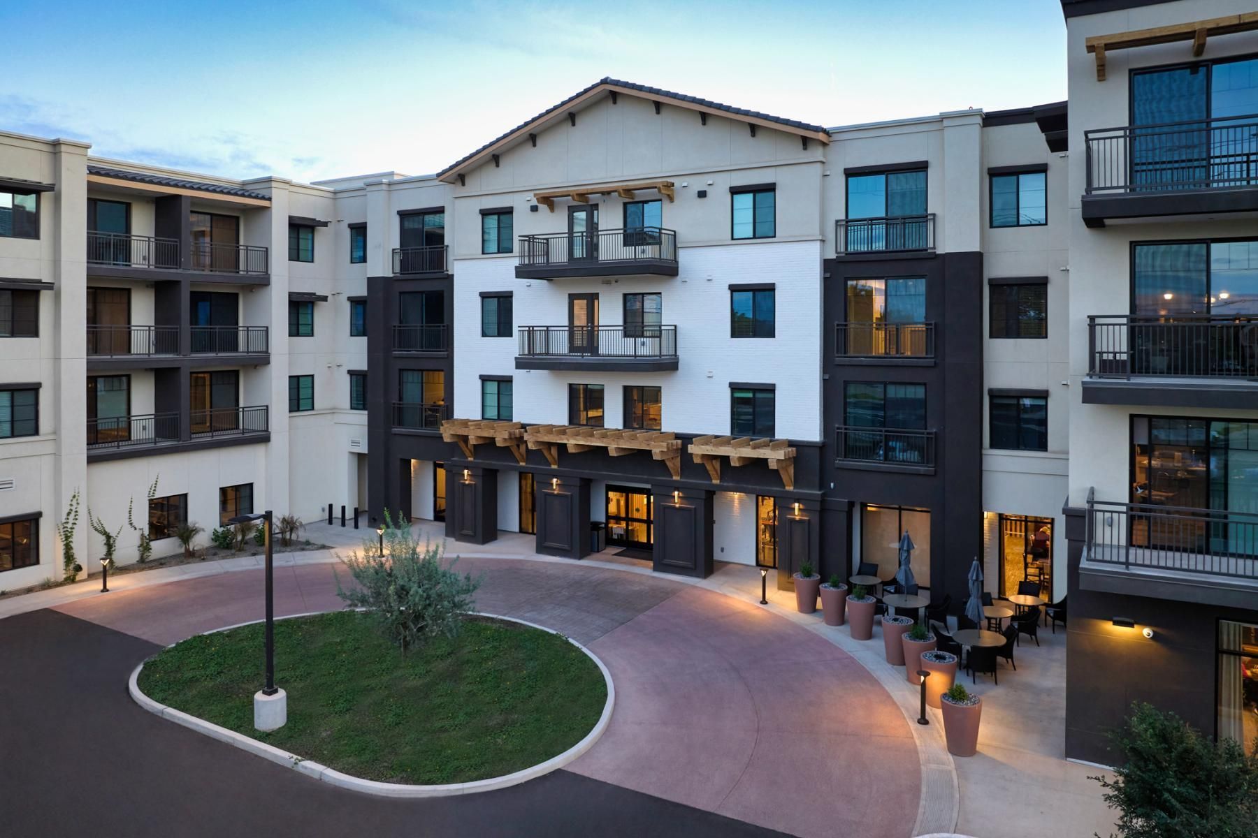 A large apartment building with a lot of windows and balconies.