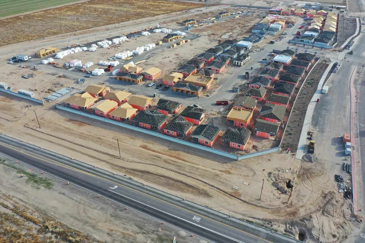 An aerial view of a construction site with a lot of houses under construction.