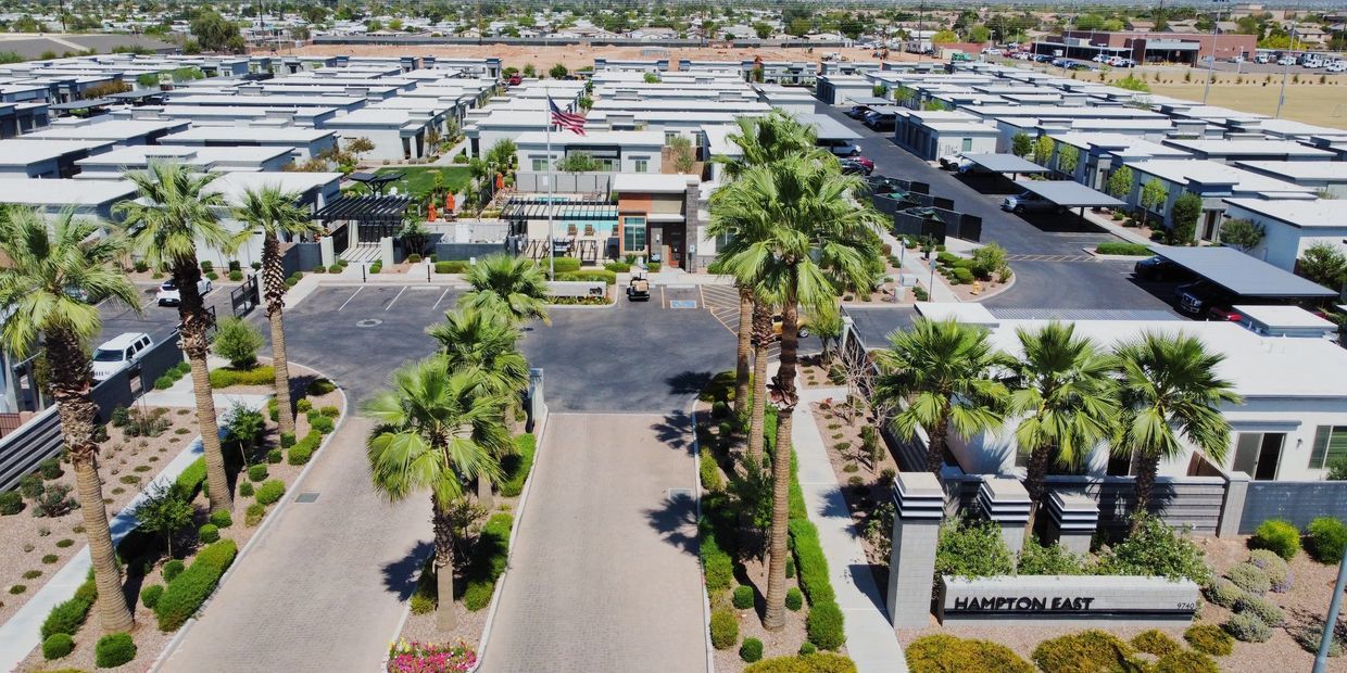 An aerial view of a mobile home park with palm trees.