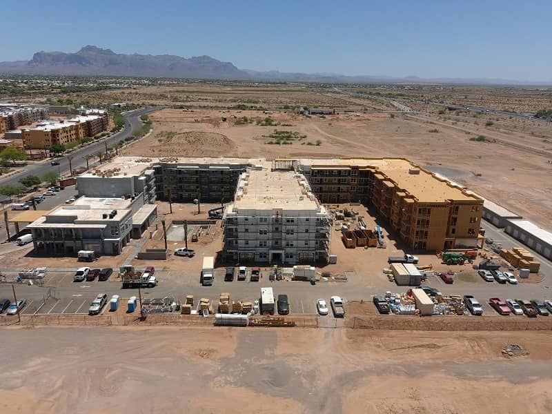 An aerial view of a building under construction in the desert