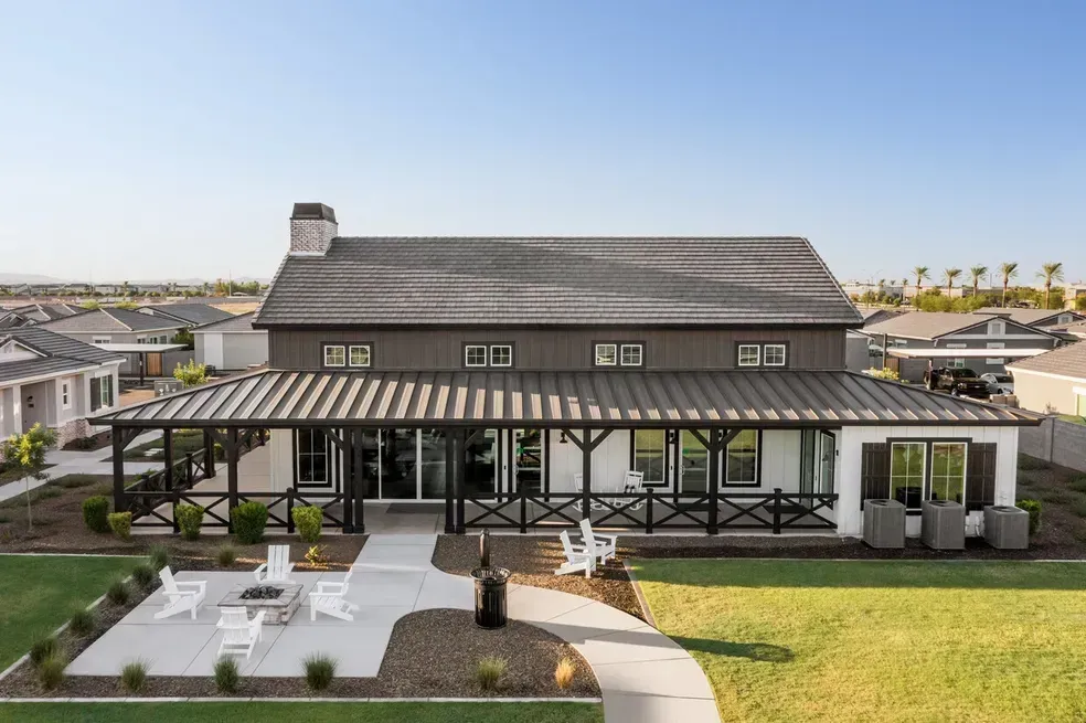 An aerial view of a large house with a large porch.