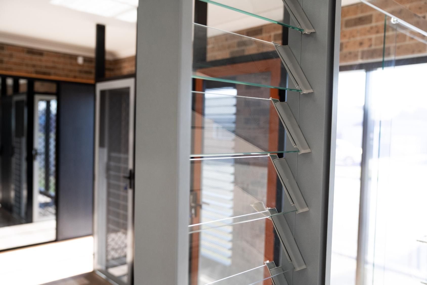 A Room With a Lot of Windows and a Shelf in the Middle of the Room — Glass 24/7 In Taree, NSW