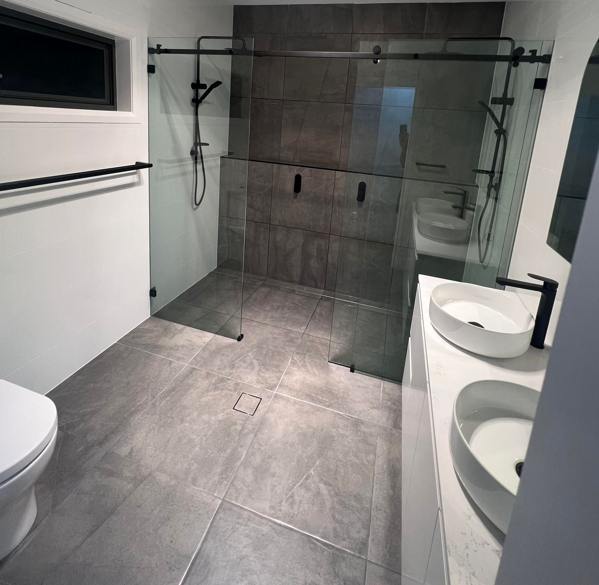 Black manhattan barn door style shower screens.