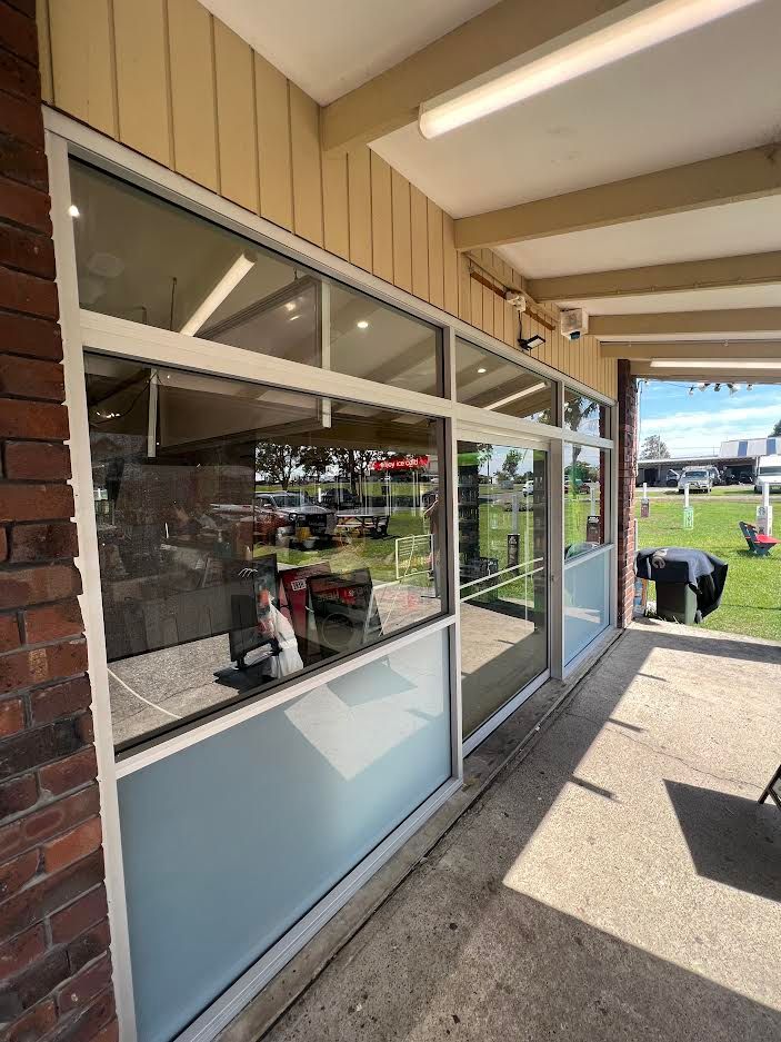 A Brick Building With A Glass Door And  — Glass 24/7 In Taree, NSW