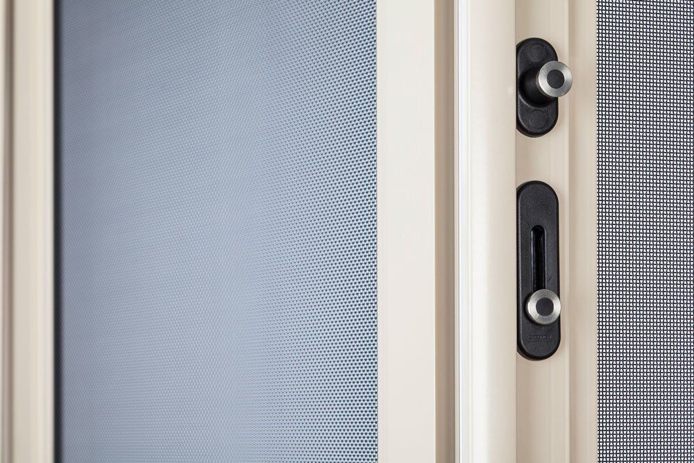 A Close Up Of A Screen Door With A Lock On It — Glass 24/7 In Tuncurry, NSW