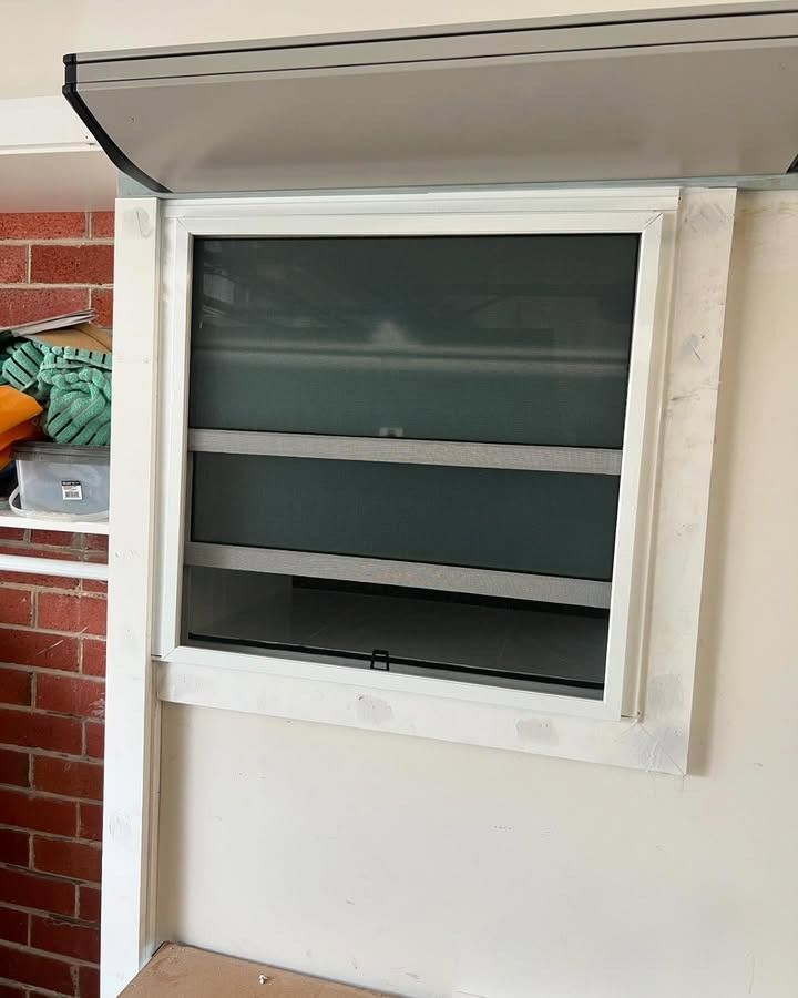A White Window With A Brick Wall In The Background — Glass 24/7 In Tuncurry, NSW